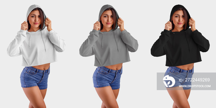 Mockup of white, gray, black crop top on a beautiful girl in blue shorts, wearing a hood, front view, set of an empty pullover for presentation of design and pattern.