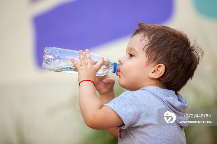 boy drinking water from a bottle