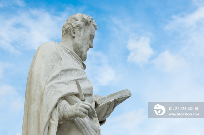 A statute in front of the Baroque style of Parish Church in Laxenburg, Lower Austria, Austria.