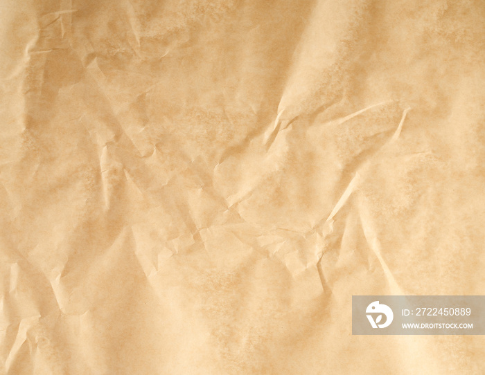 crumpled brown parchment baking paper, full frame