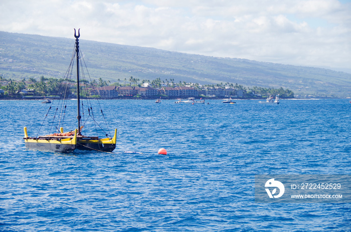 Panoramic view of city of Kailua Kona on Big Island on Hawaii with shore or coast line, palm trees and boats makes it a dream vacation destination for honeymooners