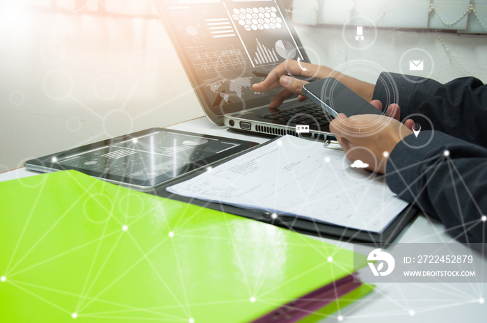 businessman working with business documents on office table with digital tablet computer and graph finance diagram in the background