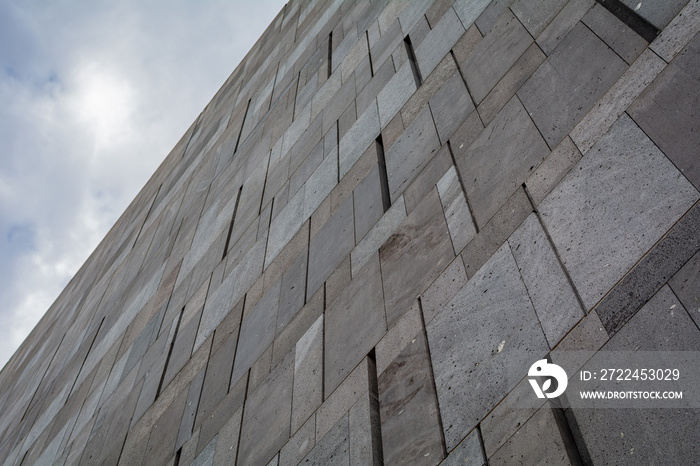 Close up of the grey concrete Facade of Mumok, the Modern art museum of Vienna, Austria