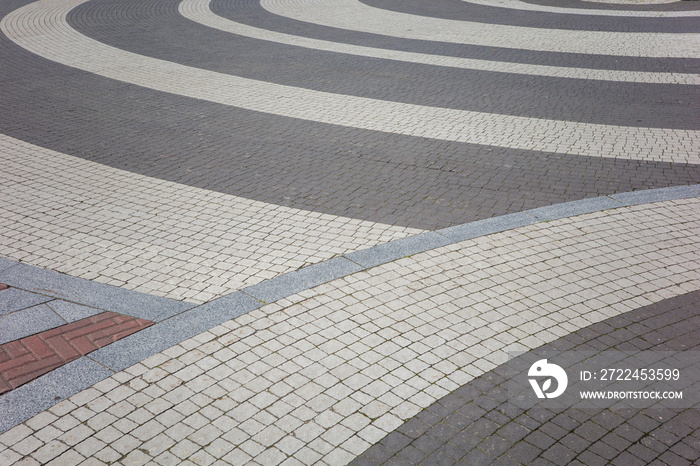 street pavement made of stone tiles lined