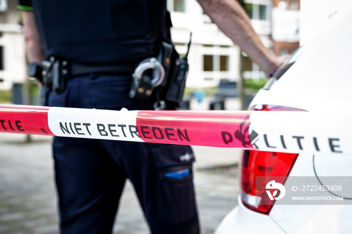 Dutch Policeman on a crime scene investigation schoolyard