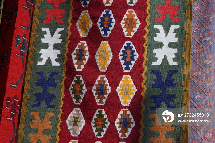 Hanged handmade traditional wool rug - vintage background close up