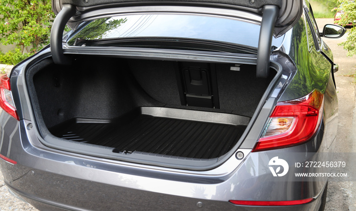 Closeup of empty rear cabin of gray sedan car parking on the road.