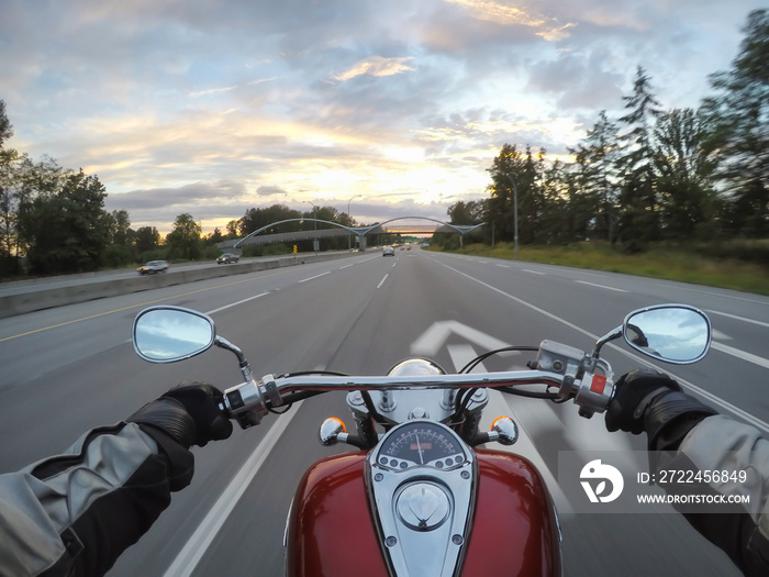 Riding a motorcycle during a vibrant sunset. Taken in Surrey, Greater Vancouver, British Columbia, Canada.