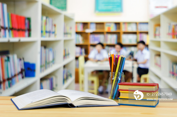 School books ,color pencil ,pen on desk,your can creative education infographics blackboard with books inside a big background, the school education concept, and gray color background,