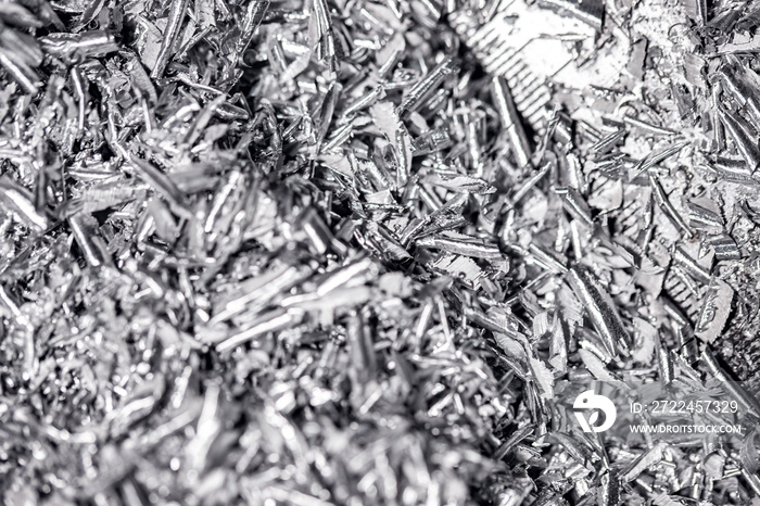 Macro photo of iron metal shavings after CNC drilling lathe machine, Industrial background