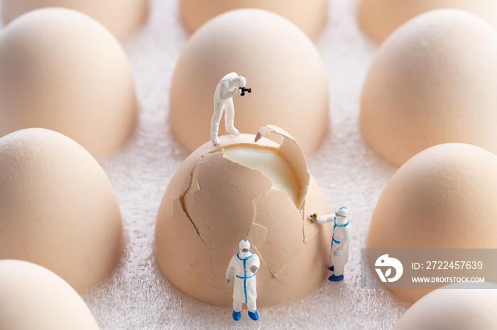 miniature inspectors checking eggs fissure. Quality control concept.