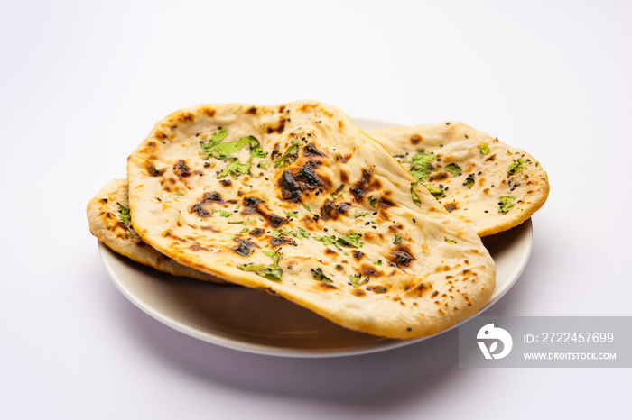 Tandoori naan, Indian Tandoori roti or flat bread served in a plate, isolated