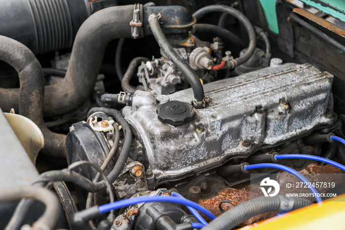 detail of old forklift engine in the garage