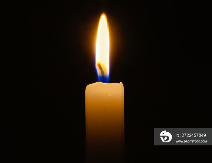 candle lit in darkness with high detail and focus.