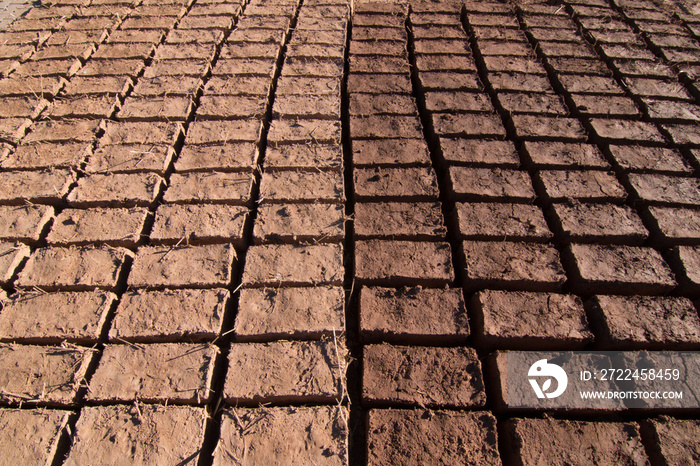 Adobe bricks drying in the sun for construction in Ouarzazate forming a pattern