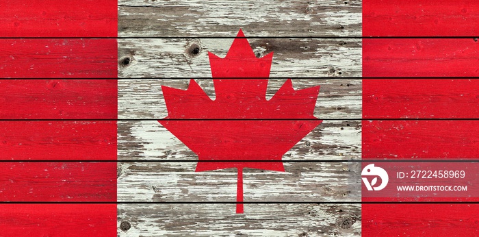 Canadian flag on a weathered rustic wood background