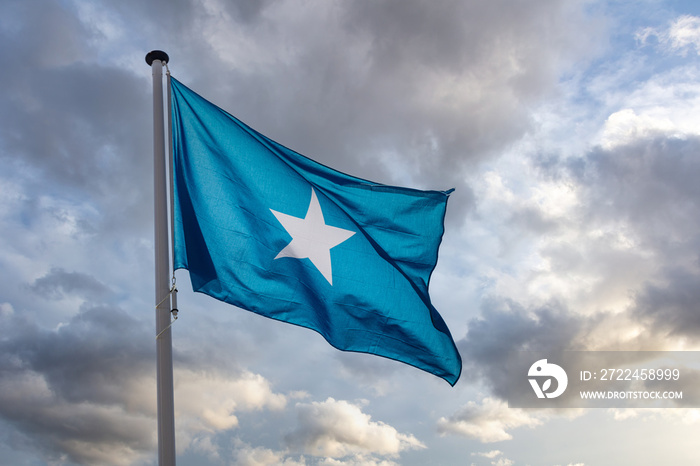 Somalia flag waving against cloudy sky