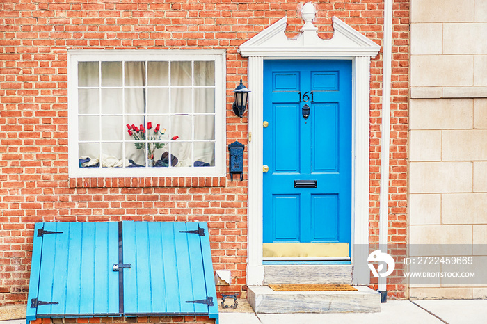 Brick house and vintage blue doors. Old town, Philadelphia, USA