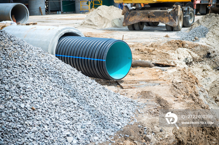 Big pipe or tube for water sewer on construction site during road repair