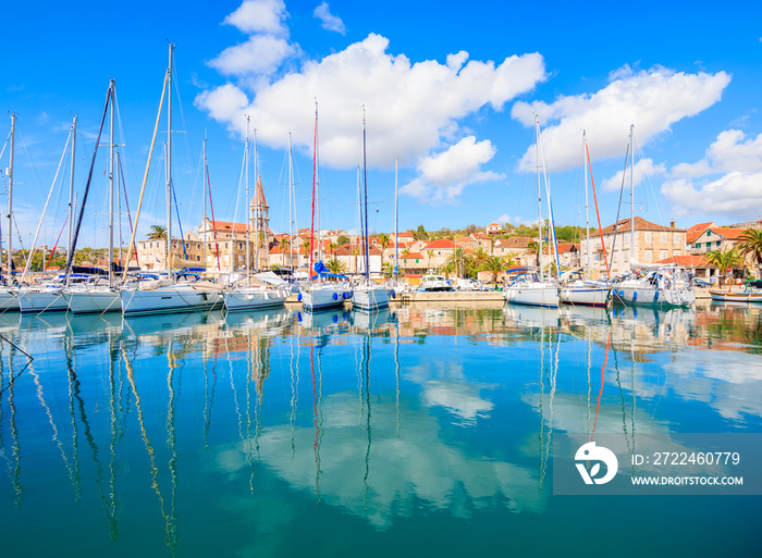 View of Milna port with sailing and fishing boats on sunny summer day, Brac island, Croatia