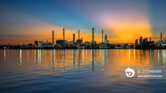 Oil refinery and sunrise at the Chao Phraya River, Thailand, petrochemical Industrial, oil refinery and oil industry.