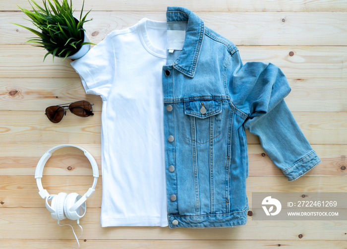 flat lay White tshirt mockup and denim jacket jeans on brown wooden background. Template,