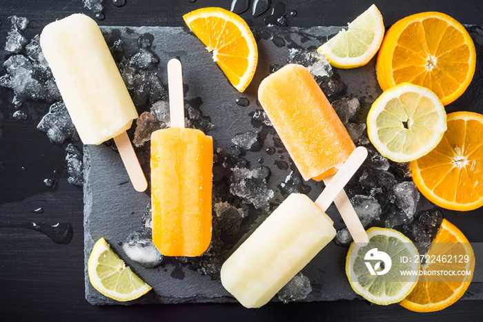 Homemade orange and lemon popsicles