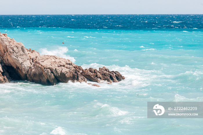 Rock in azure sea in Nice France, minimalistic mood