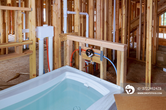 Bathroom unfinishing new home installation of plumbing, faucets, water and sewerage.