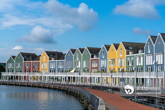 view of the colorful rainbow houses and lake in Houten