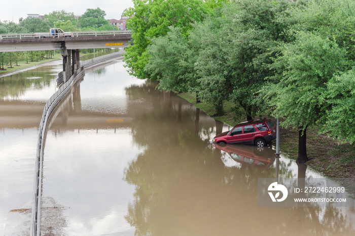 Red car swamped by high water near downtown Houston, Texas