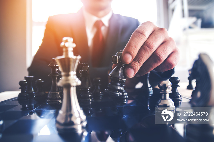 Detail of a hand making the first move in a chess game, moving the pawn one field forward. Selective focus