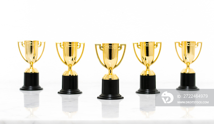 Golden trophy cup isolated on white background.