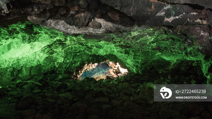 Jameos del Agua in Lanzarote, cave of volcanic origin illuminated with green light and a lake inside