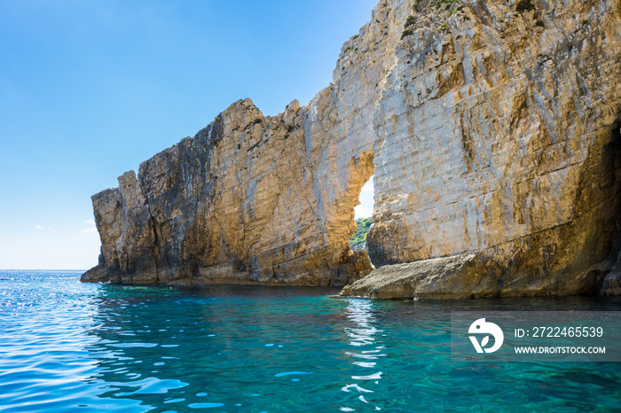 Greece, Zakynthos, Blue sky and perfect turquoise clear water at white stone arch near keri caves