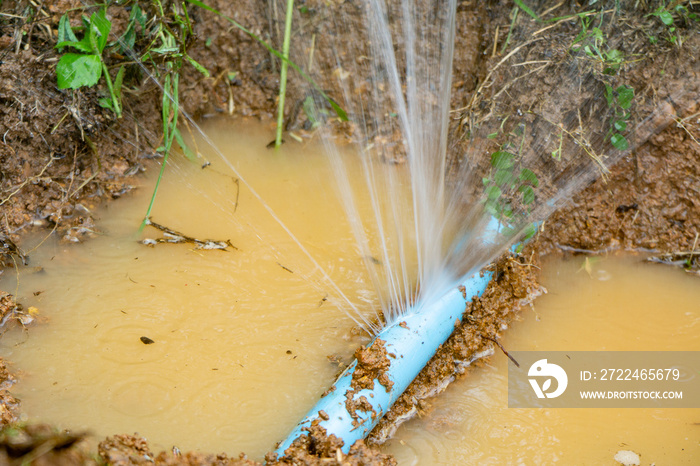 Water pipe break,leaking from hole in a hose  connection joint of plastic pipes Water supply system,selective focus