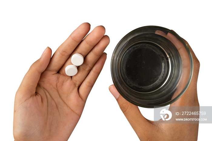 hand holding medicine and a glass of water isolated