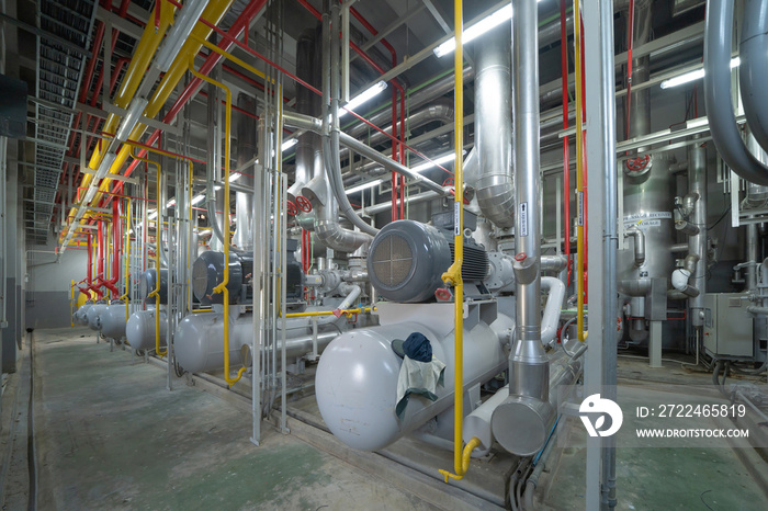 Inside of Industry factory. Chiller tower or cooling tower in building. System work machine. Condenser Water Supply and return pipe lines. Ventilation compressor. Water system in workshop.