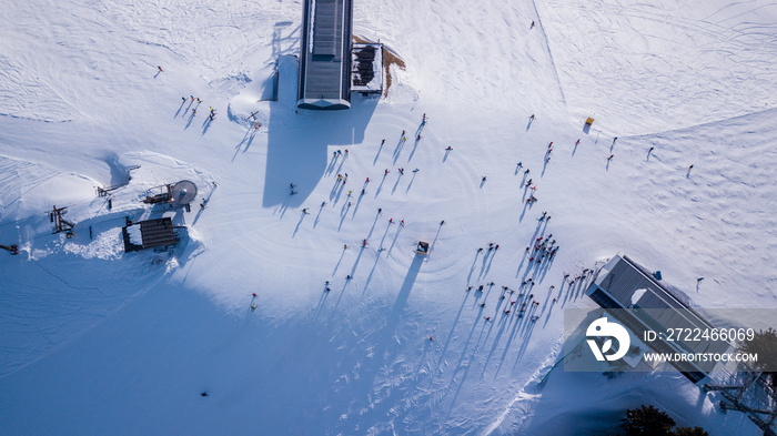 Winter landscape scene at a ski resort, with snow covered trees and slopes, on a bluebird day