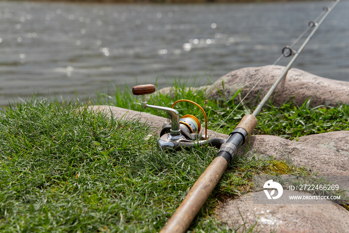 Fishing rod near the river ready for fishing