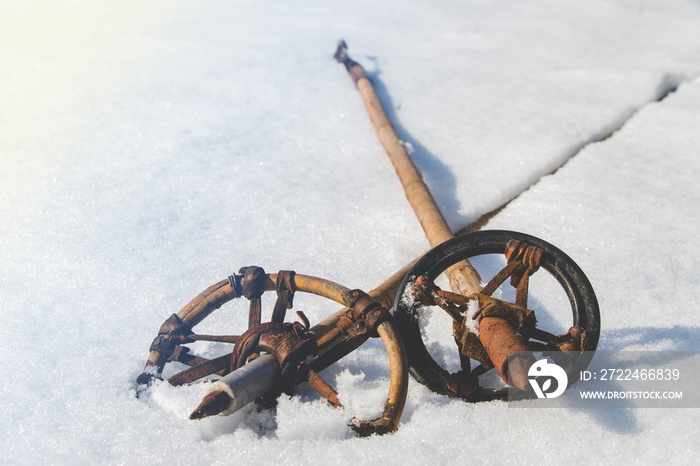 Vintage ski poles in snow, winter is coming. retro style