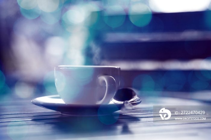 hot coffee and blue bokeh background