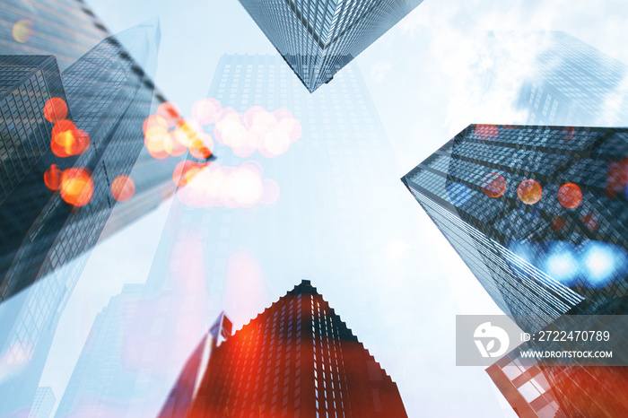 Low angle view on tops of modern city office buidings on blue sky background