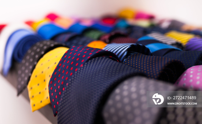 ties on hangers in men clothing store