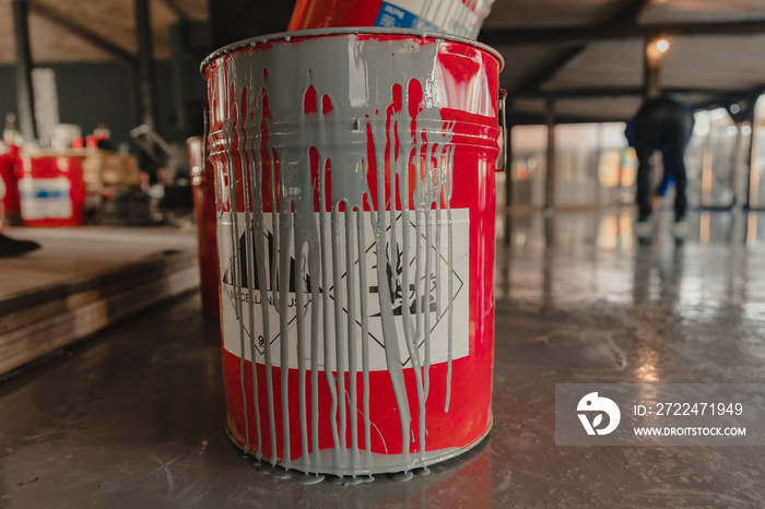 Tin bucket with toxic composition and epoxy resin inside