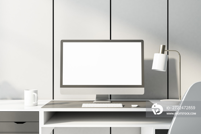 Monochrome style home workplace with blank white computer monitor on white table at light wall background. Mock up