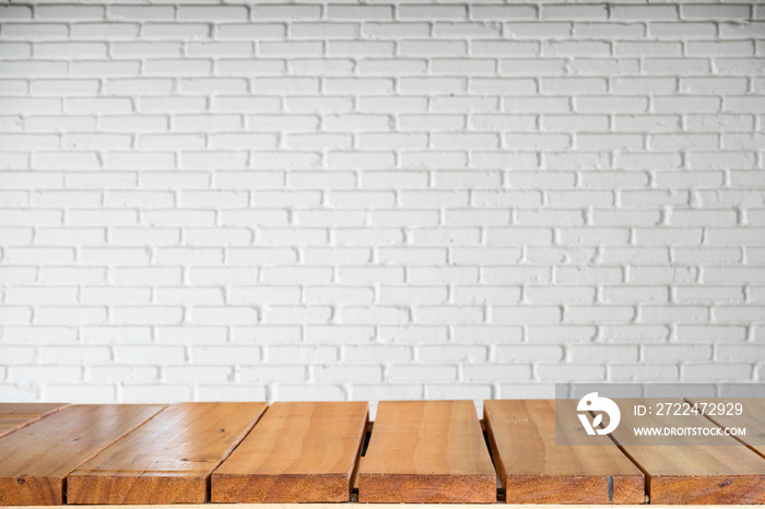 Empty top of natural wooden table and retro white brick wall background. For product display