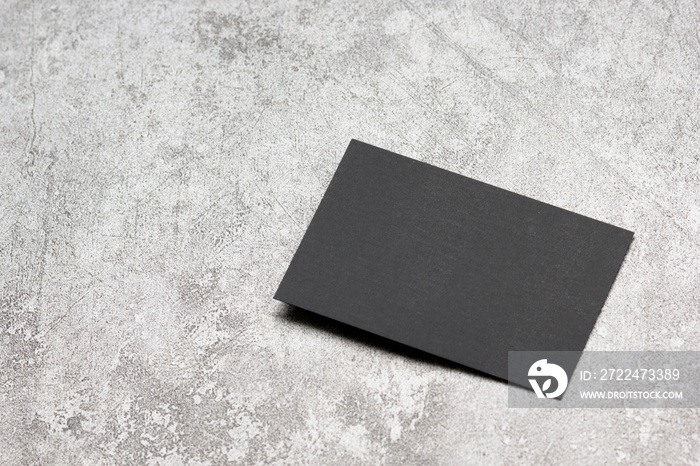 Black business cards blank on textured background. Identity design, corporate templates, company style. Flat lay