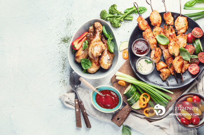 Grilled chicken meat meals on table. Top view with copy space