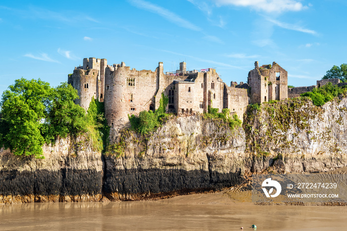 View across river to Chepstow Castle - the oldest surviving post-Roman stone fortification in Britain, found in 1067. Copy space in sky.